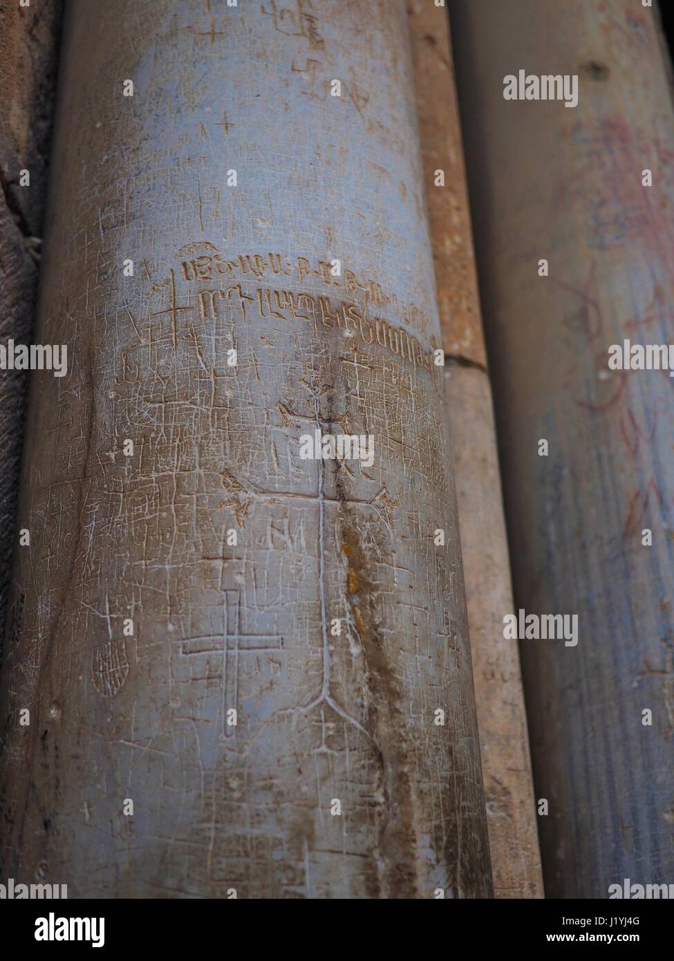 Columns with crusaders graffity in the Church of the Holy Sepulchre in Jerusalem Stock Photo