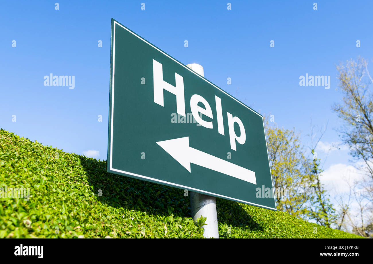 Help concept sign. Help and an arrow on a signpost. Stock Photo