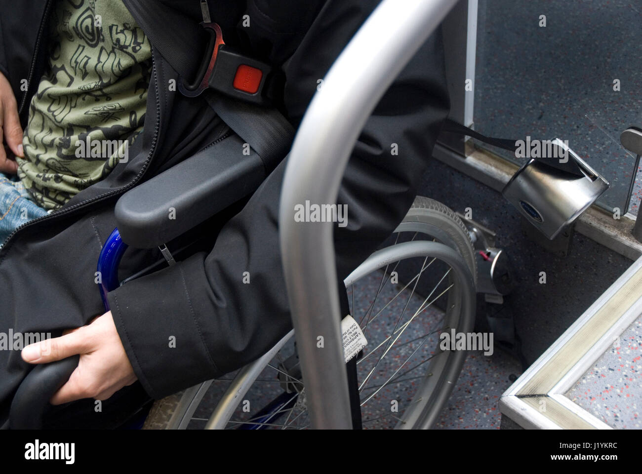 Young man on a wheelchair boarding suburban trains in Atocha Station