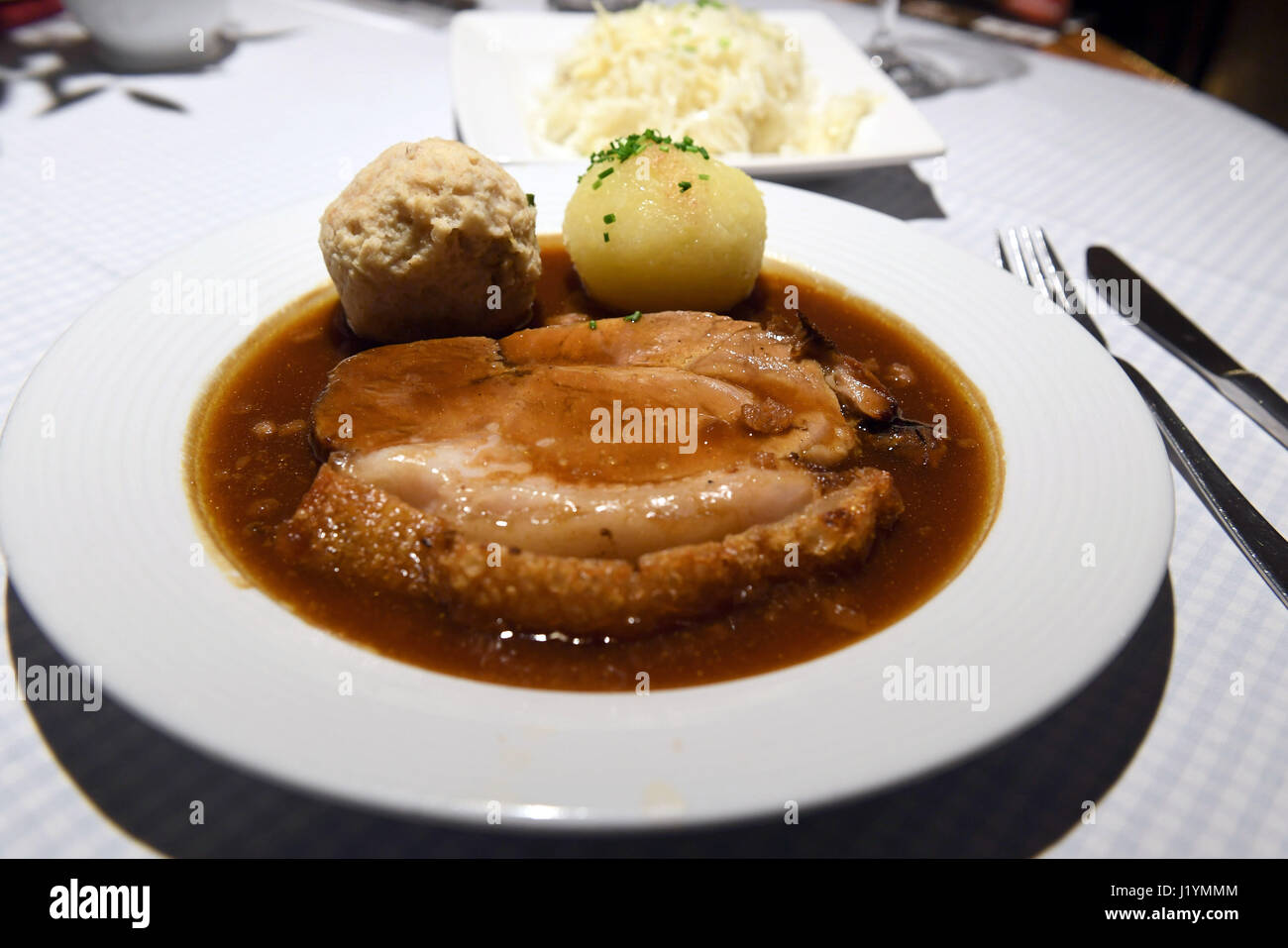 Munich, Germany. 20th Apr, 2017. Roast Pork with dumplings and cabbage