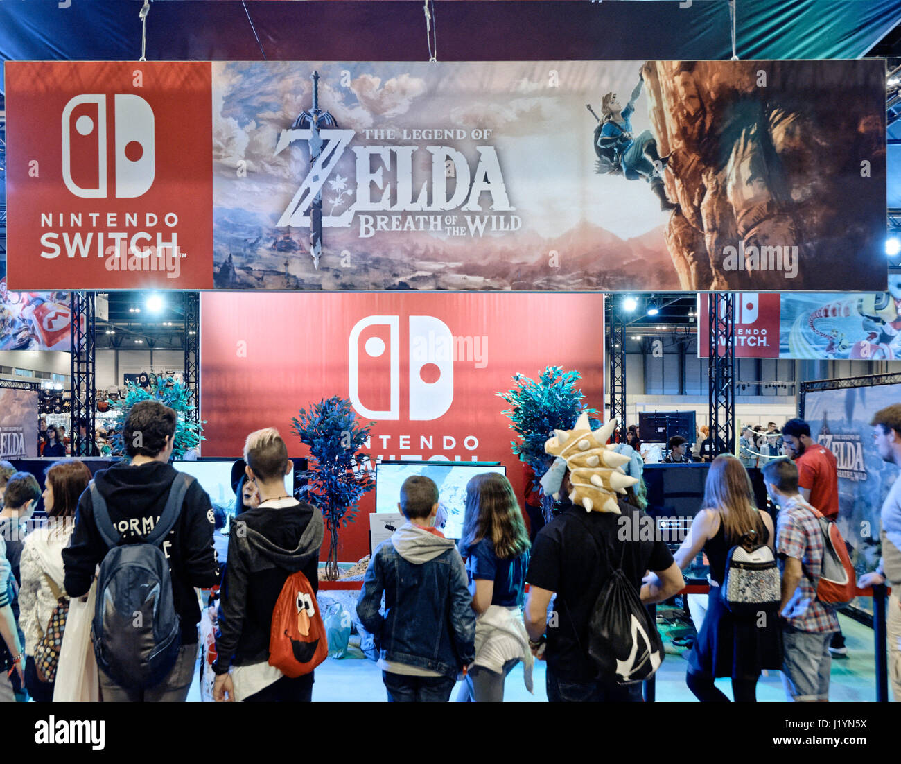 Madrid, Spain - April 22, 2017: Nintendo stand presenting the Nintendo  Switch game console in front of a crowd of young people in the fair Heroes  Manga Madrid on IFEMA, Madrid, Spain.