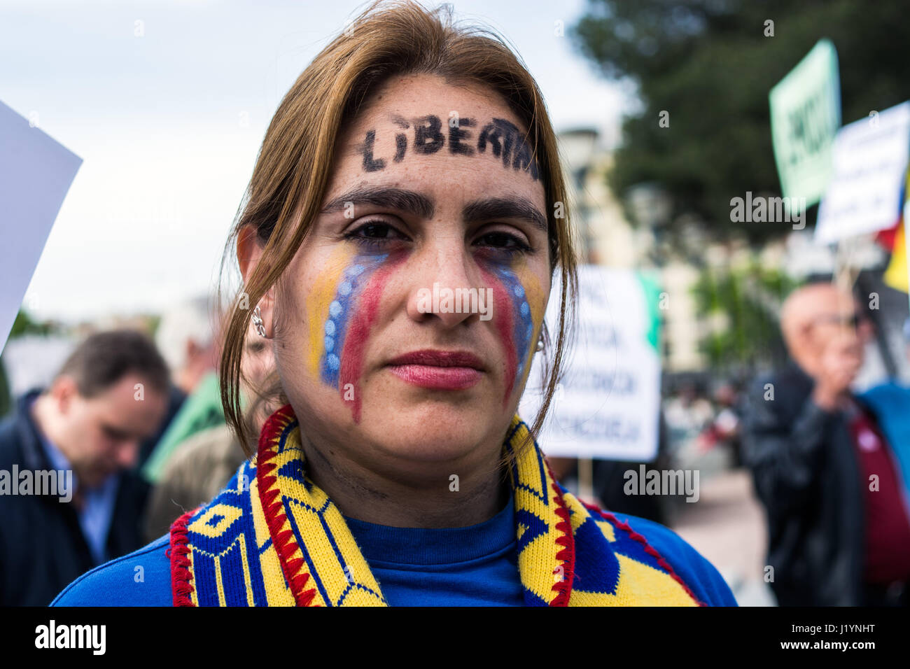 Madrid, Spain. 22nd April, 2017. Venezuelan woman with her face painted, protesting the current situation of their country in Madrid, Spain. Credit: Marcos del Mazo/Alamy Live News Stock Photo