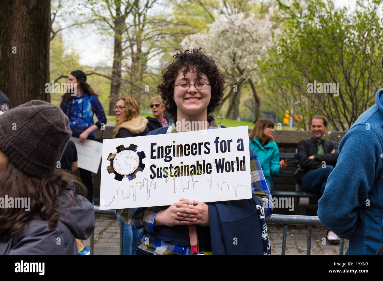 New York, USA. 22nd April, 2017. An unidentified woman holds a sign that has a big skull and reads 'Climate Change' during the March For Science on April 22, 2017 in New York. Credit: Justin Starr/Alamy Live News Stock Photo