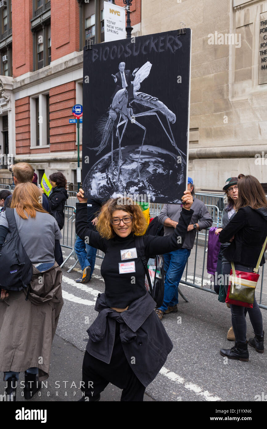 New York, USA. 22nd April, 2017. An unidentified woman holds a sign that reads 'Bloodsuckers!' and depicts Pres. Trump riding a mosquito labeled 'GOP' during the March For Science on April 22, 2017 in New York. Credit: Justin Starr/Alamy Live News Stock Photo
