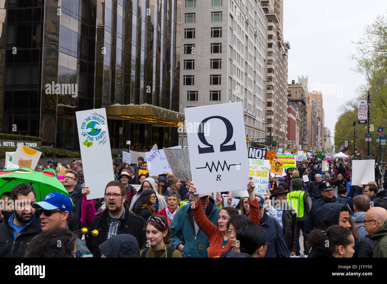 New York, USA. 22nd April, 2017. With many holding signs, the procession of the March For Science passes in front of the Trump International Hotel & Tower on Central Park West on April 22, 2017 in New York. Credit: Justin Starr/Alamy Live News Stock Photo