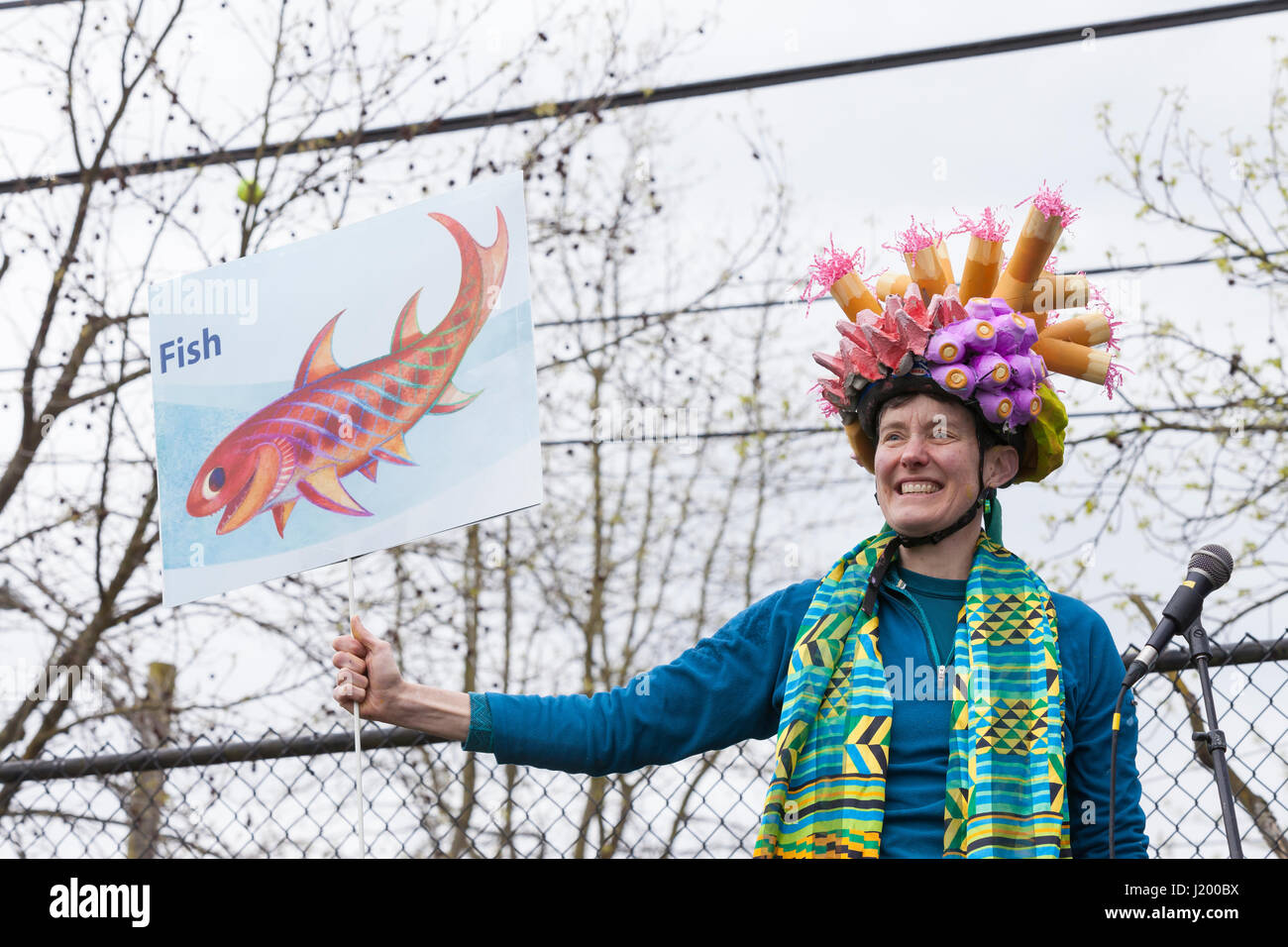 Seattle, Washington,USA. 22nd April, 2017. Karen Lewis co-author of “Grandmother Fish” a child's first book of Evolution, appears at the rally in Cal Anderson Park. The March for Science Seattle, a non-partisan rally and sister march to the National March for Science and over 600 cities across the world on Earth Day. Thousands marched from Cal Anderson Park in the Capitol Hill neighborhood to Seattle Center to celebrate science and the role it plays in everyday lives as well as to protest the policies of the Trump administration. Stock Photo