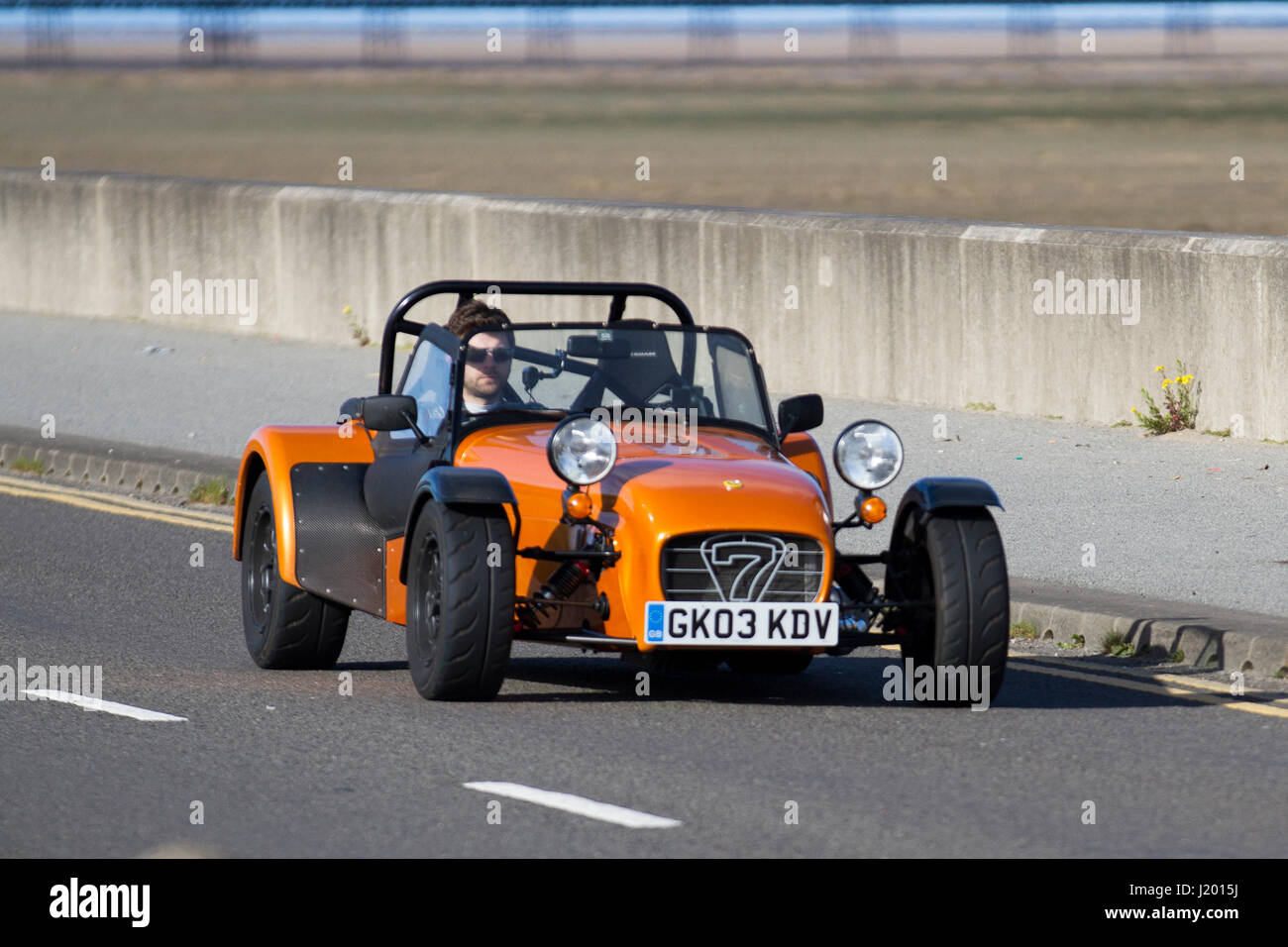 Caterham 2003 7  Southport, Merseyside, UK. UK Weather. 23rd April, 2017. Bright sunny but chilly start with temperatures expected to reach double figures in the north west. Early morning activities as residents of the resort and visitors travel on the north-west coast using the cycleway and paths on the seaward side of the promenade. Credit: MediaWorldImages/Alamy Live News Stock Photo