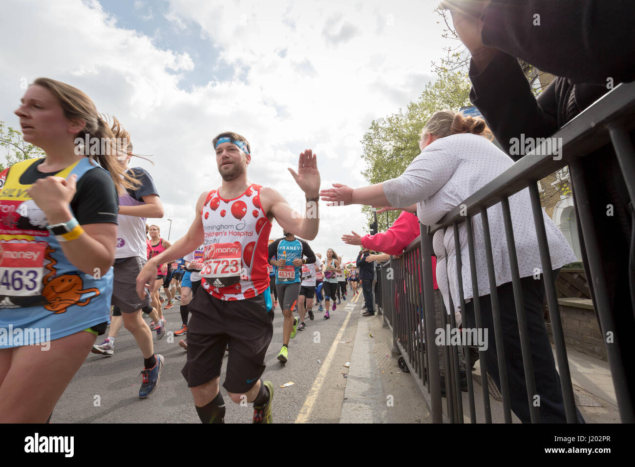 London, UK. 23rd Apr, 2017. Thousands of runners during the 37th London Marathon pass through Deptford in south east London. Credit: Guy Corbishley/Alamy Live News Stock Photo