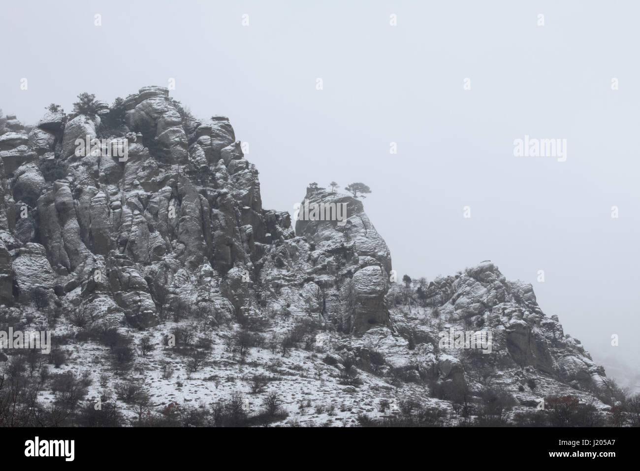 Close-up view of Mount Demerdji on a solid grey background made of clouds Stock Photo