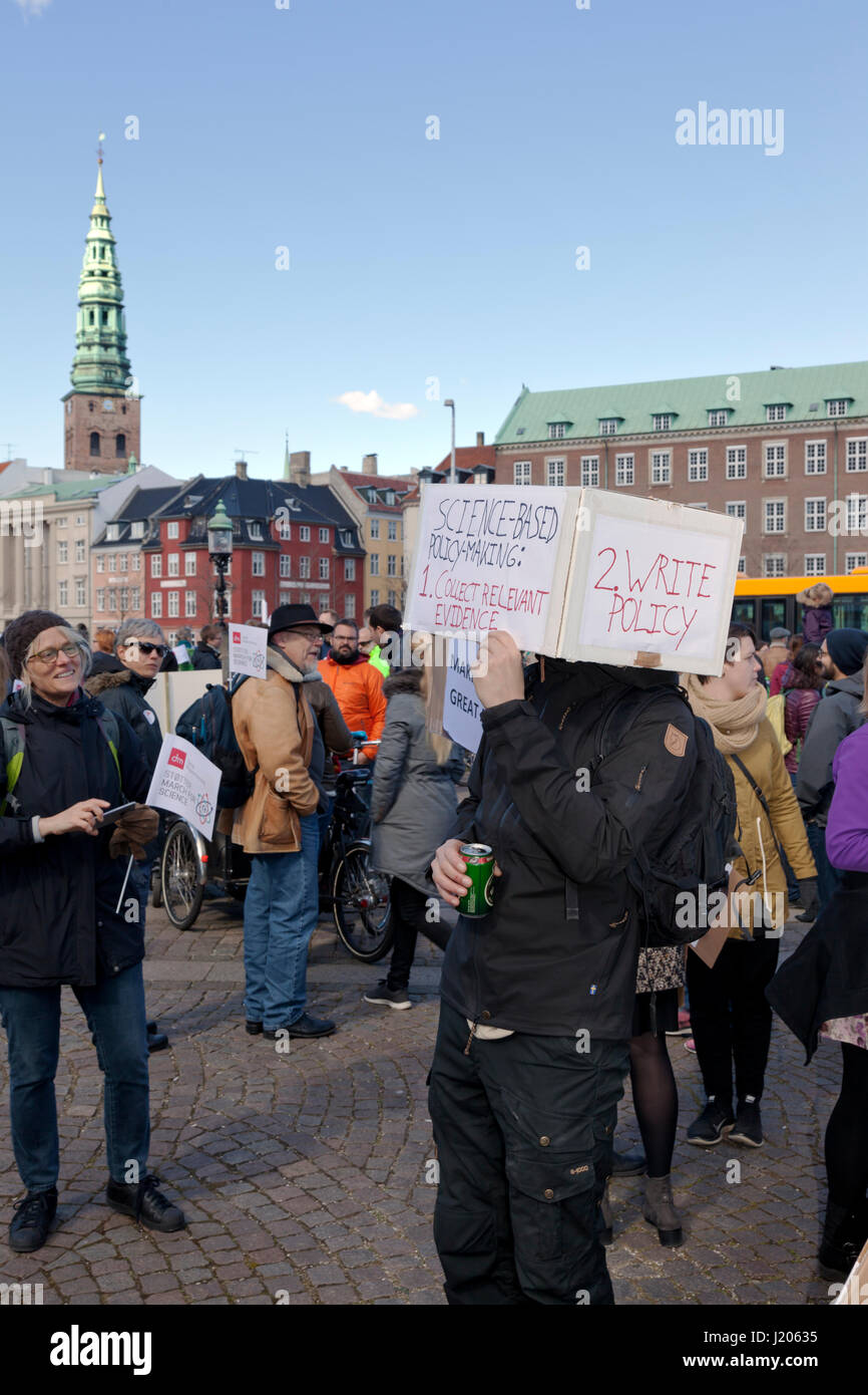 The March for Science in Copenhagen arrives at Christiansborg Castle Square after a two hours march through Copenhagen from the Niels Bohr Institute. Stock Photo