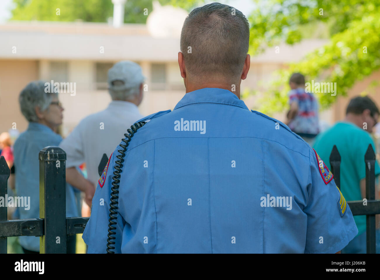 A cop stands ready to keep order at the Raleigh March for Science on