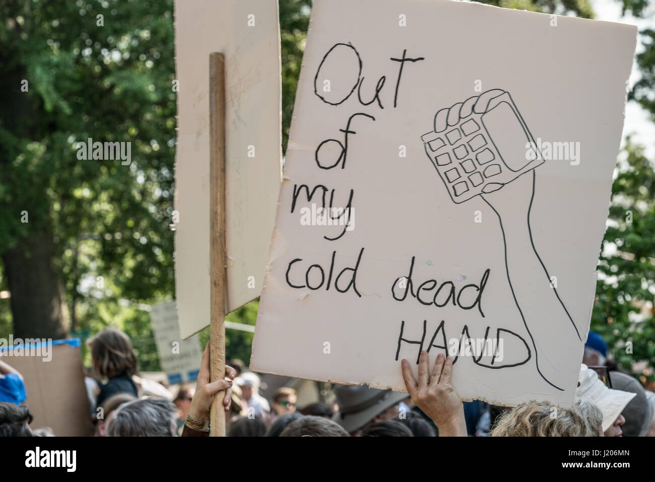 Protesters hold signs high at the Raleigh March for Science held on April 22, 2017. Stock Photo