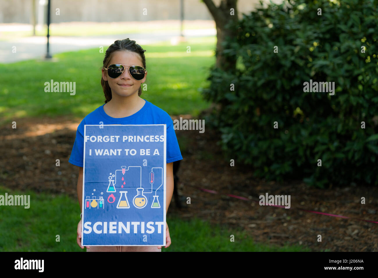 A young girl holds a protest sign at the Raleigh, NC, March for Science in April 2017. Stock Photo