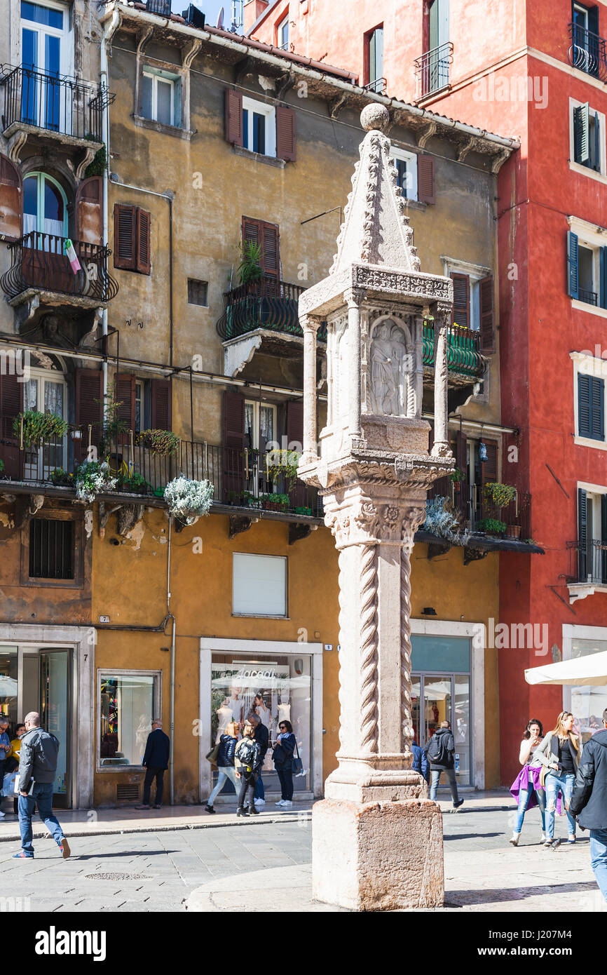 VERONA, ITALY - MARCH 29, 2017: medieval column on Piazza delle Erbe (Market's square) in Verona in spring. Verona is city on the Adige river, one of  Stock Photo