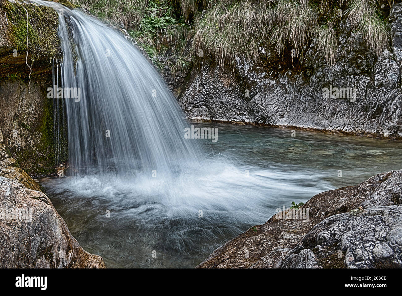 long time exposure on the river in Val Vertova, spring season near city of Bergamo - Lombardy, Italy Stock Photo