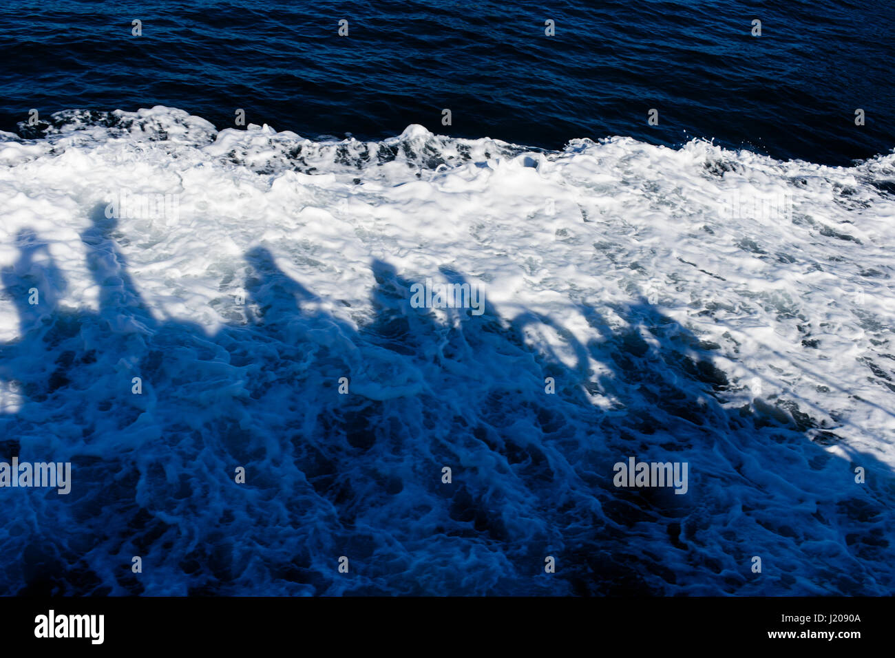 Shadow of people on sea Stock Photo