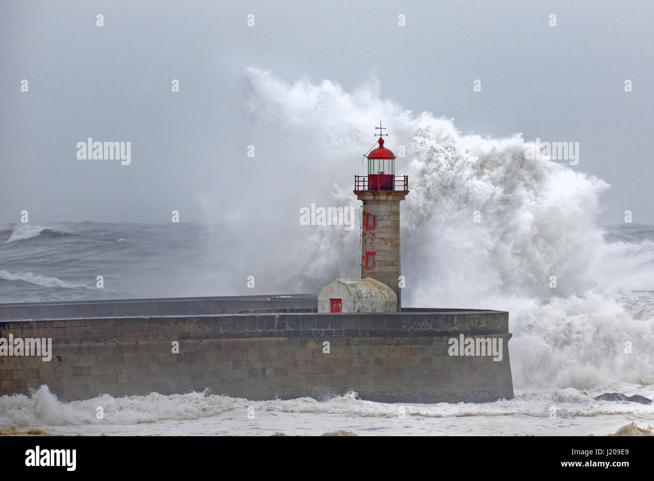 Lighthouse of Porto with storm, Portugal, Europe Stock Photo