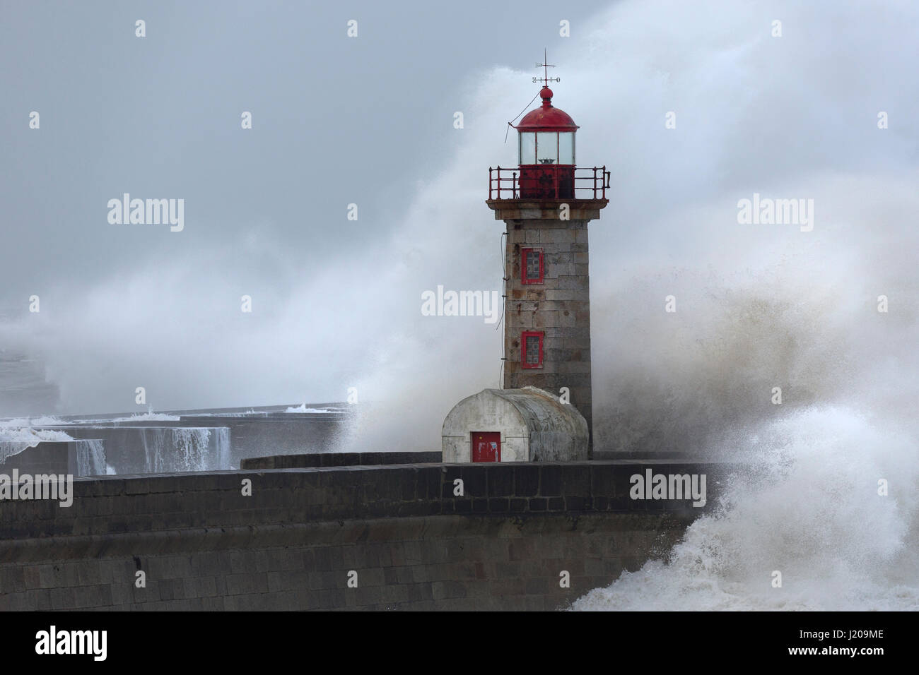 Lighthouse of Porto with storm, Portugal, Europe Stock Photo