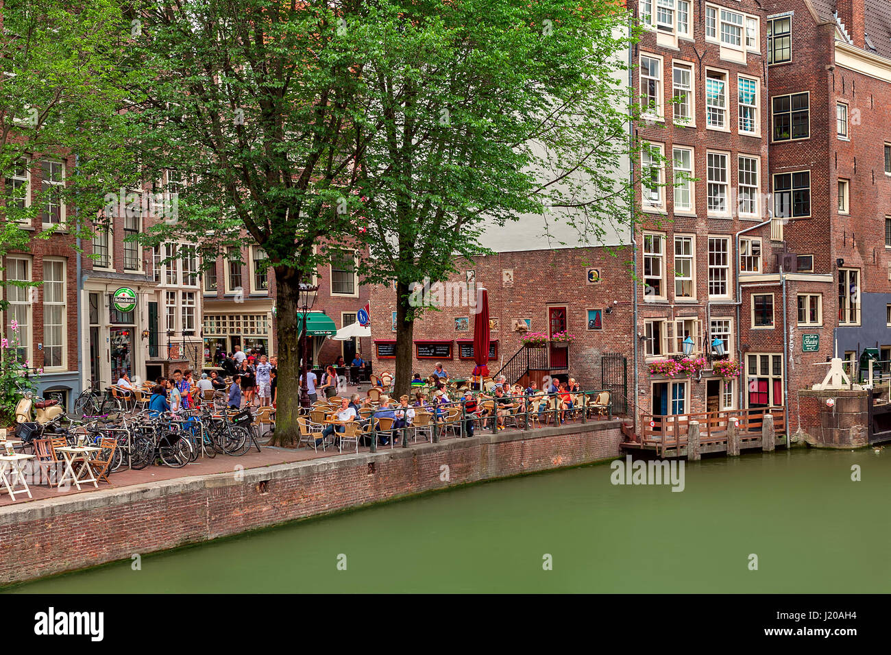 AMSTERDAM, NETHERLANDS JULY 07, 2015 Outdoor restaurant along canal
