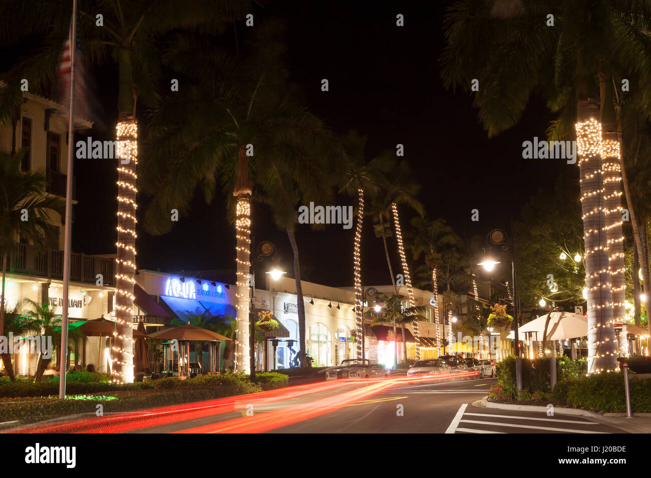 Naples, Fl, USA - March 21, 2017: Street in the city of Naples illuminated at night. Florida, United States Stock Photo