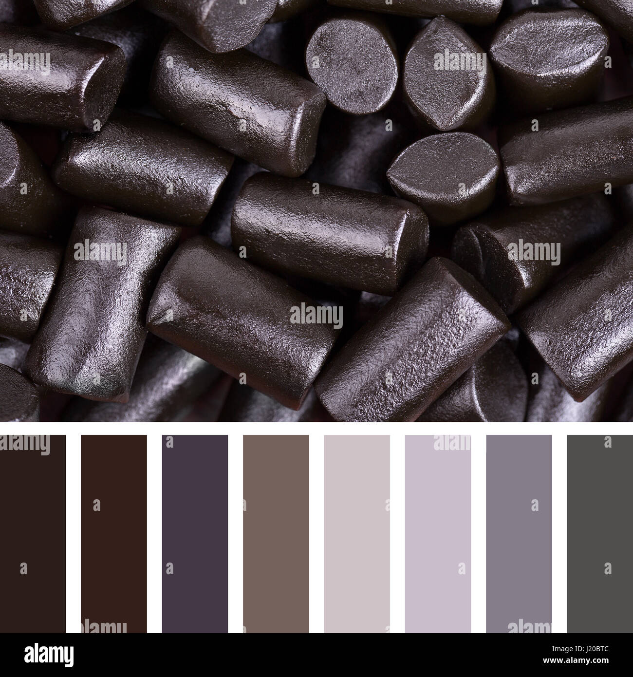 A background of cut pieces of black liquorice in a colour palette with