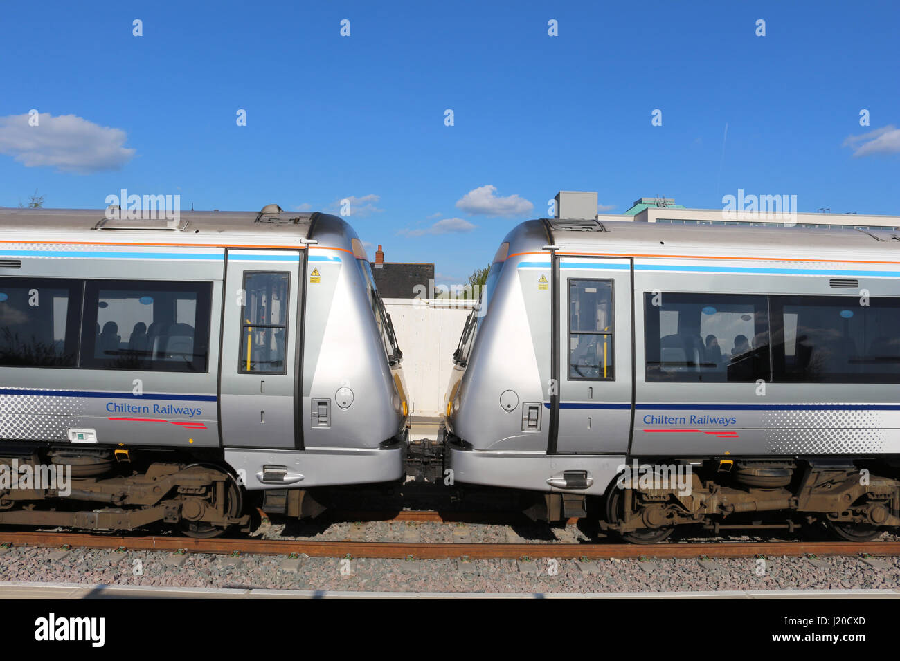 Chiltern Railways liveried class 168 turbostar diesel multiple units in a bay platform at Oxford railway station on 22nd April 2017. Stock Photo