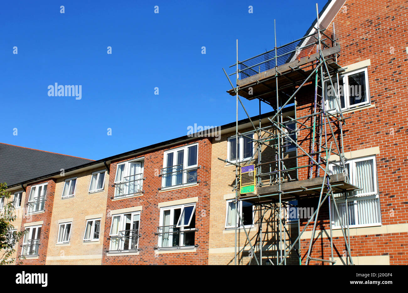 EASTFIELD, SCARBOROUGH, NORTH YORKSHIRE, ENGLAND - 10th of October 2016: Scaffolding on exterior of modern commercial building on 10th October 2016. Stock Photo