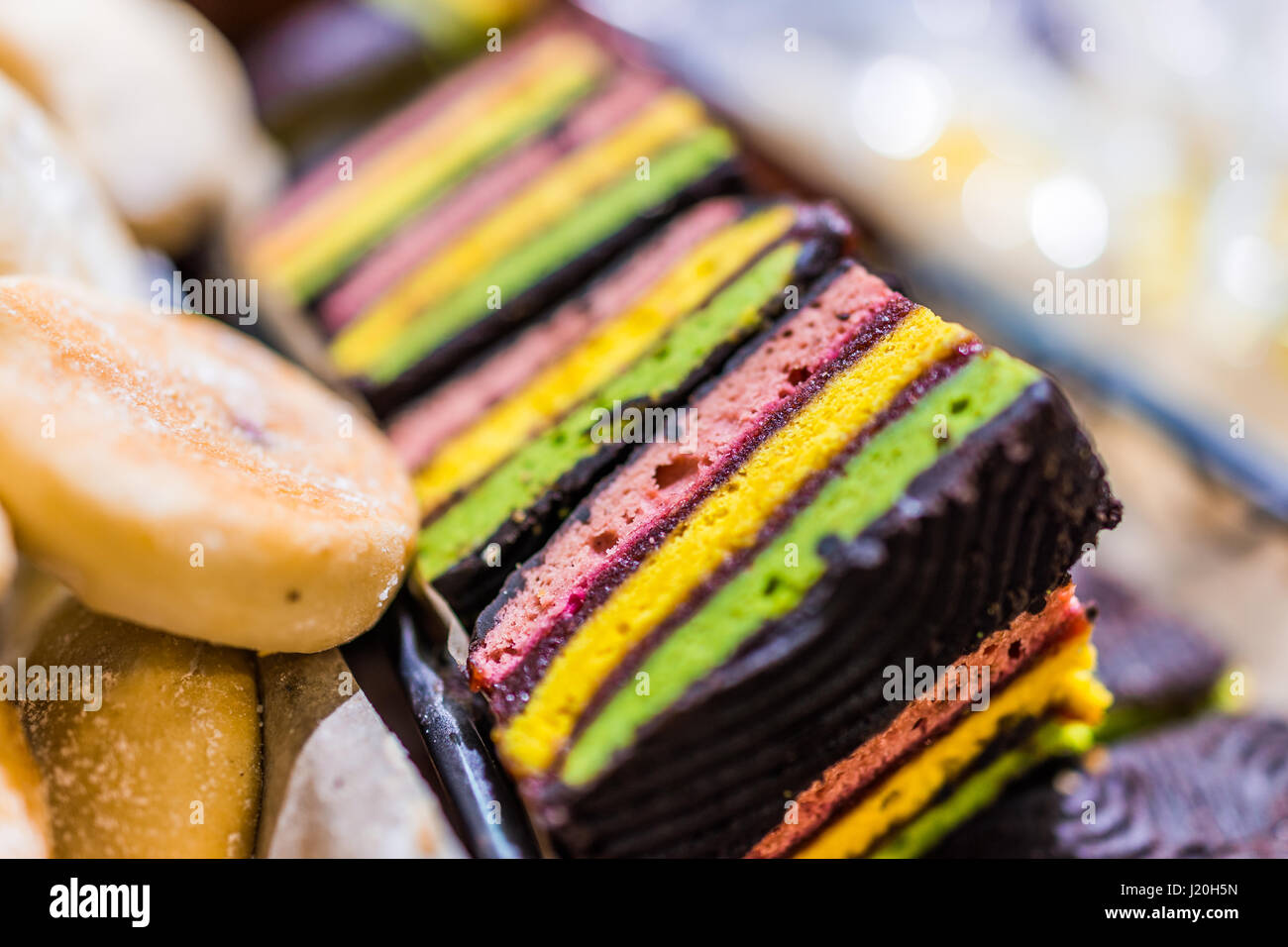 Macro closeup of colorful cookie or cake bars covered in chocolate Stock Photo