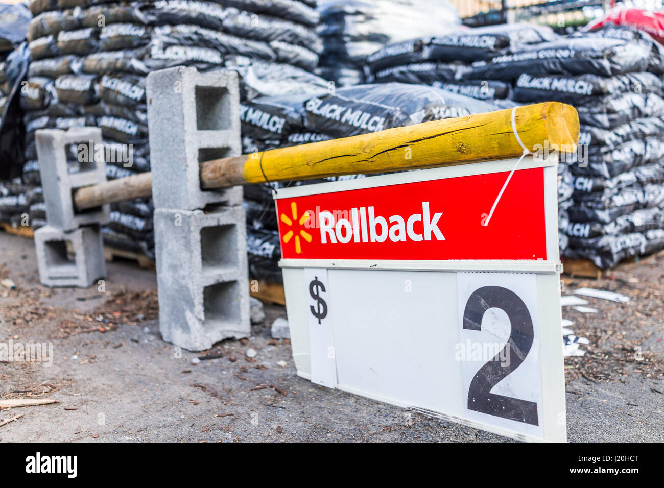 Burke, USA - April 16, 2017: Macro closeup of rollback two dollar sign in Walmart outside garden center store building for mulch Stock Photo