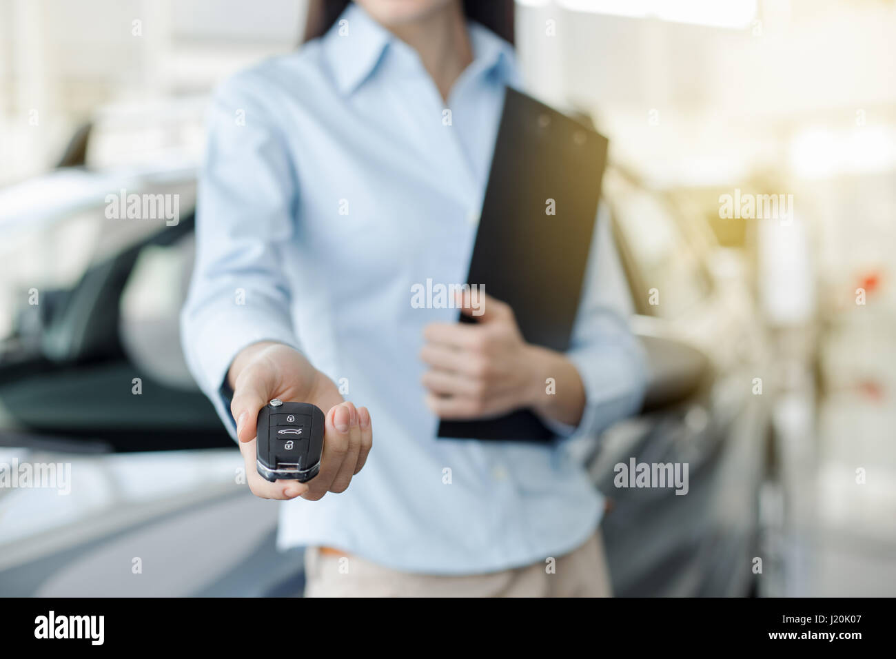 Young Woman in a Car Rental Service Assistant Concept Stock Photo Alamy