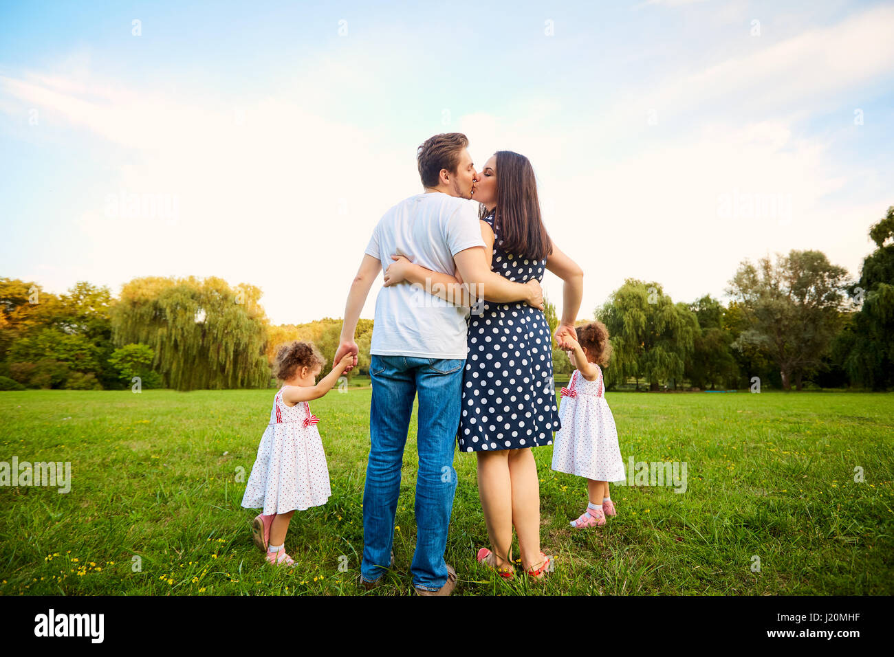 The concept of a happy family. Parents with children Stock Photo - Alamy