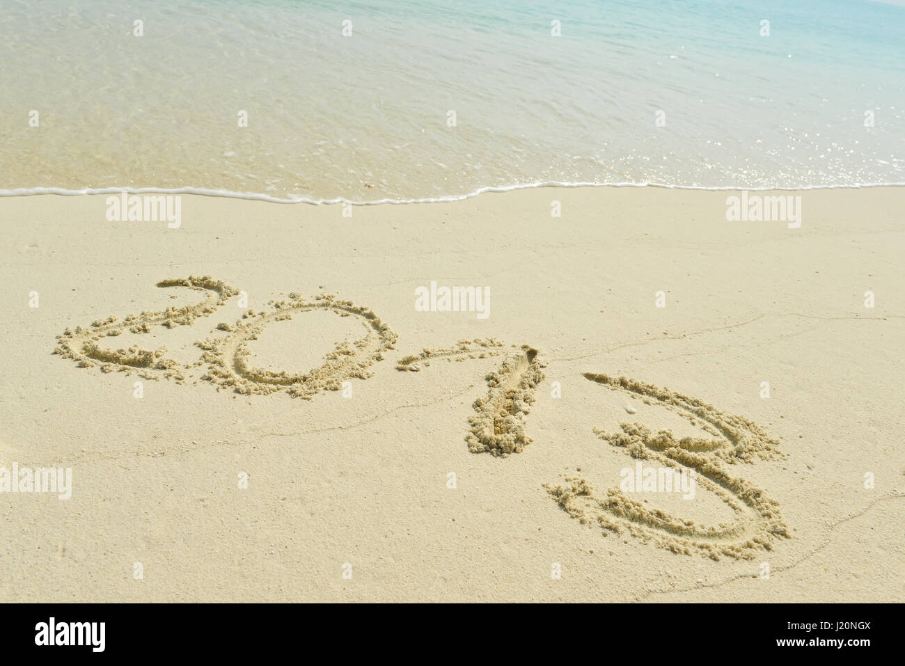 2013 written in sand on beach Stock Photo