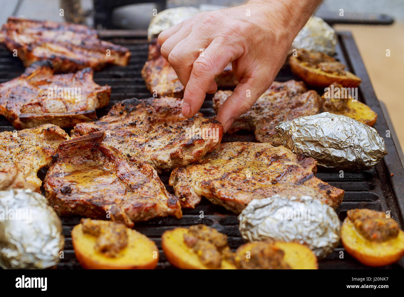 A top sirloin steak flame broiled on a barbecue, shallow depth of field. steak barbecue Stock