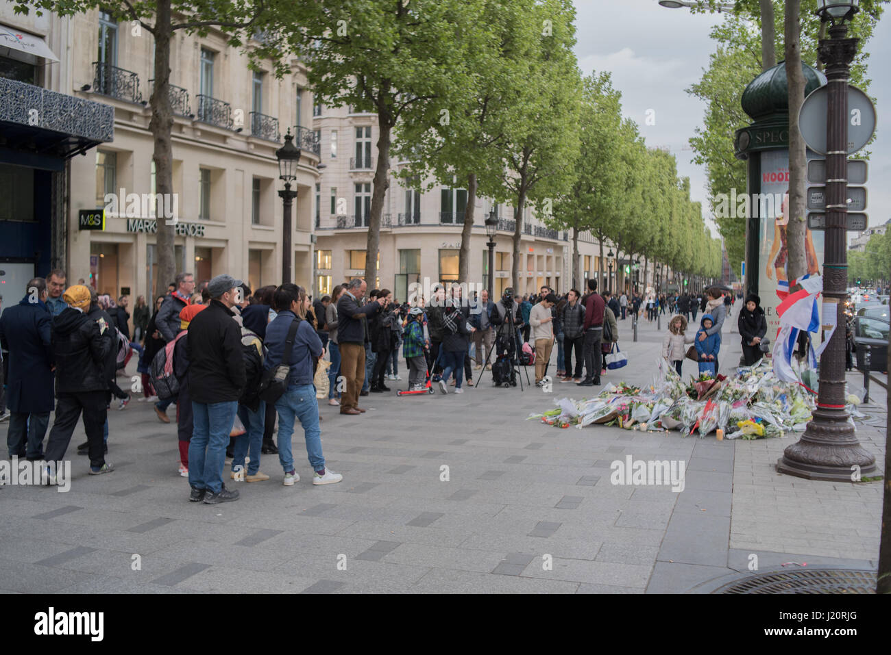 Attack on the Champs-Elysées: symbolic deposit of flowers in tribute to the police officer Stock Photo