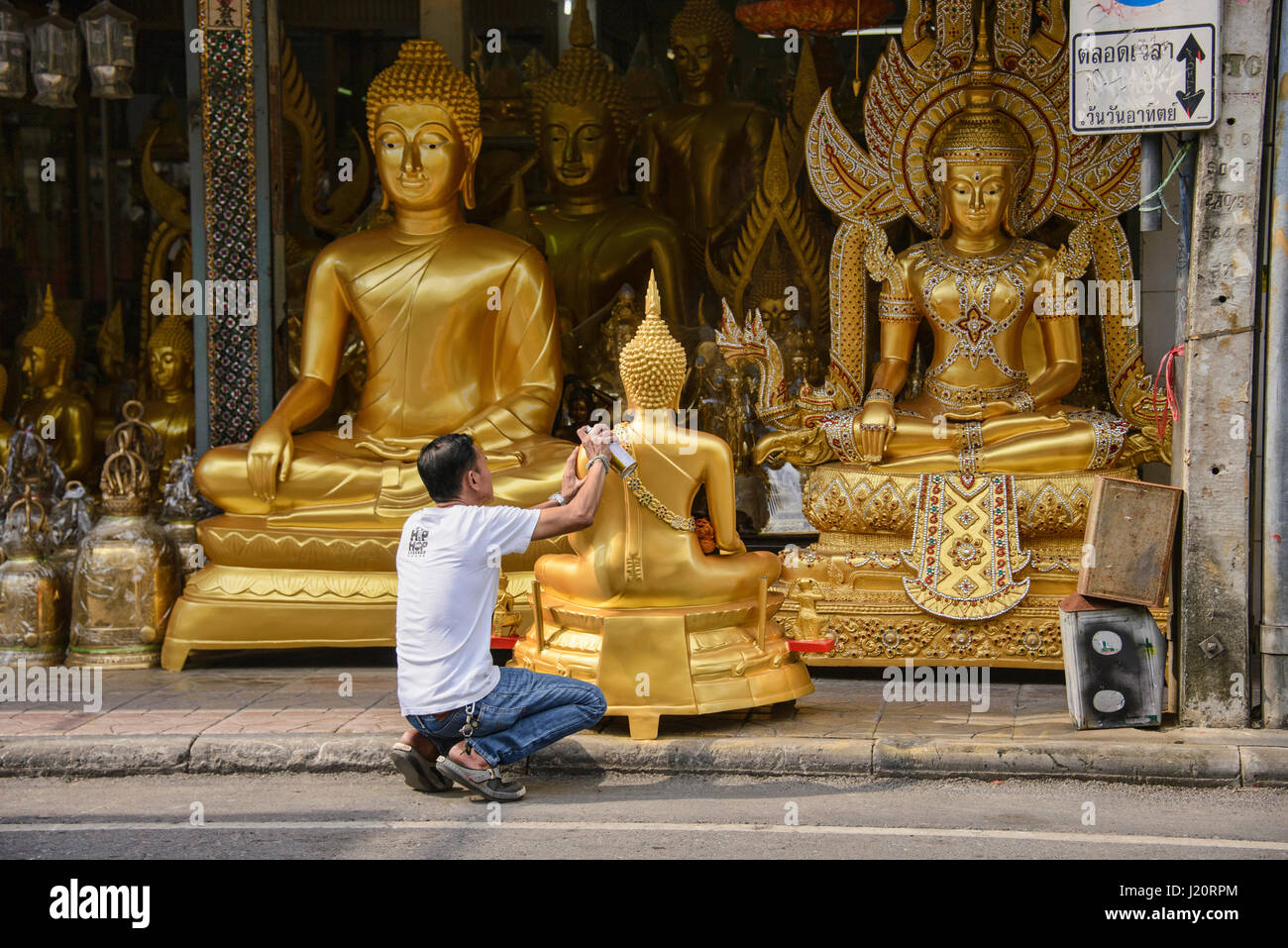 Street of Buddha statues in Bangkok, Thailand Stock Photo