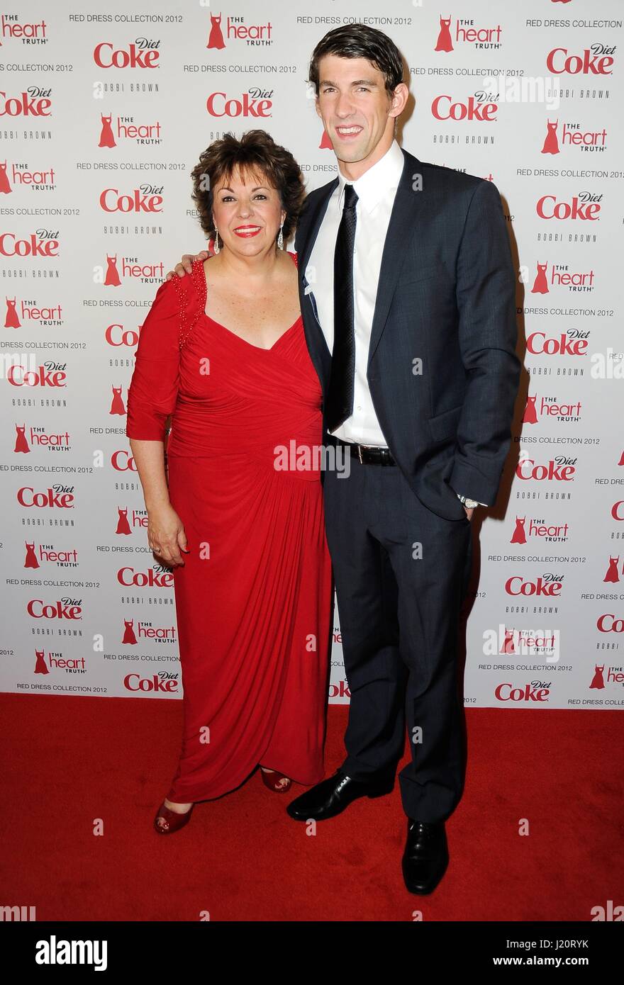 Olympic swimmer Michael Phelps and mother Debbie Phelps walk the red ...