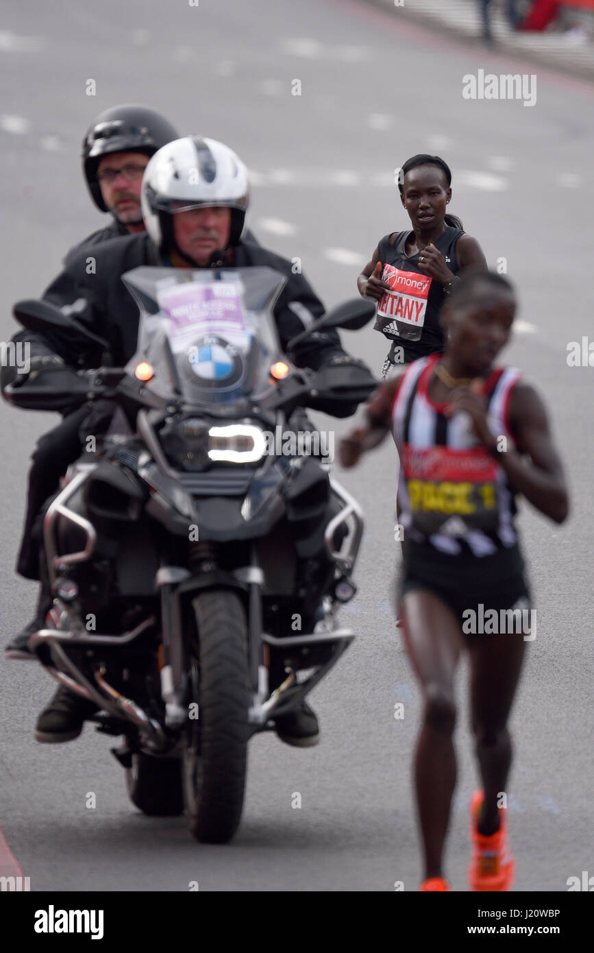 Winner Mary Keitany at the 2017 Virgin London Marathon after crossing Tower Bridge and alongside the Tower of London Stock Photo