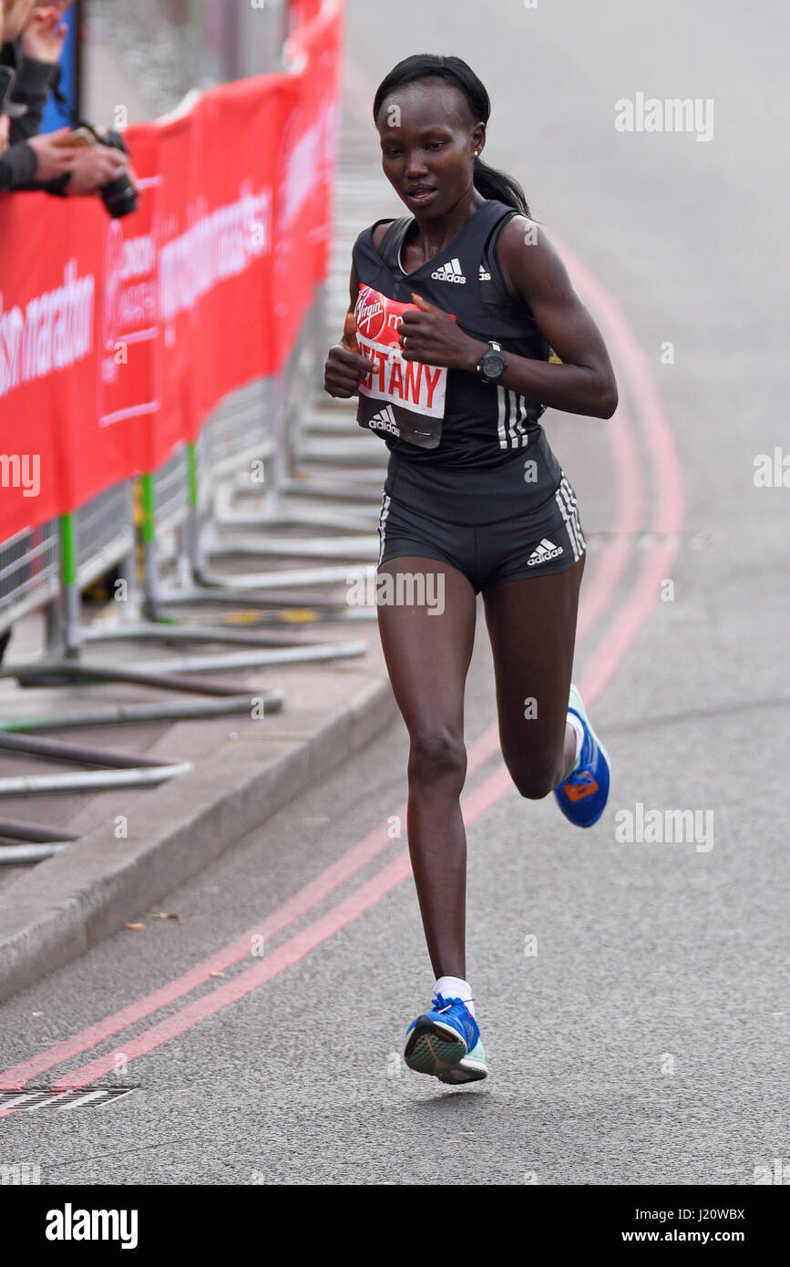 Mary Keitany at the 2017 Virgin London Marathon after crossing Tower Bridge and alongside the Tower of London. Winner Stock Photo