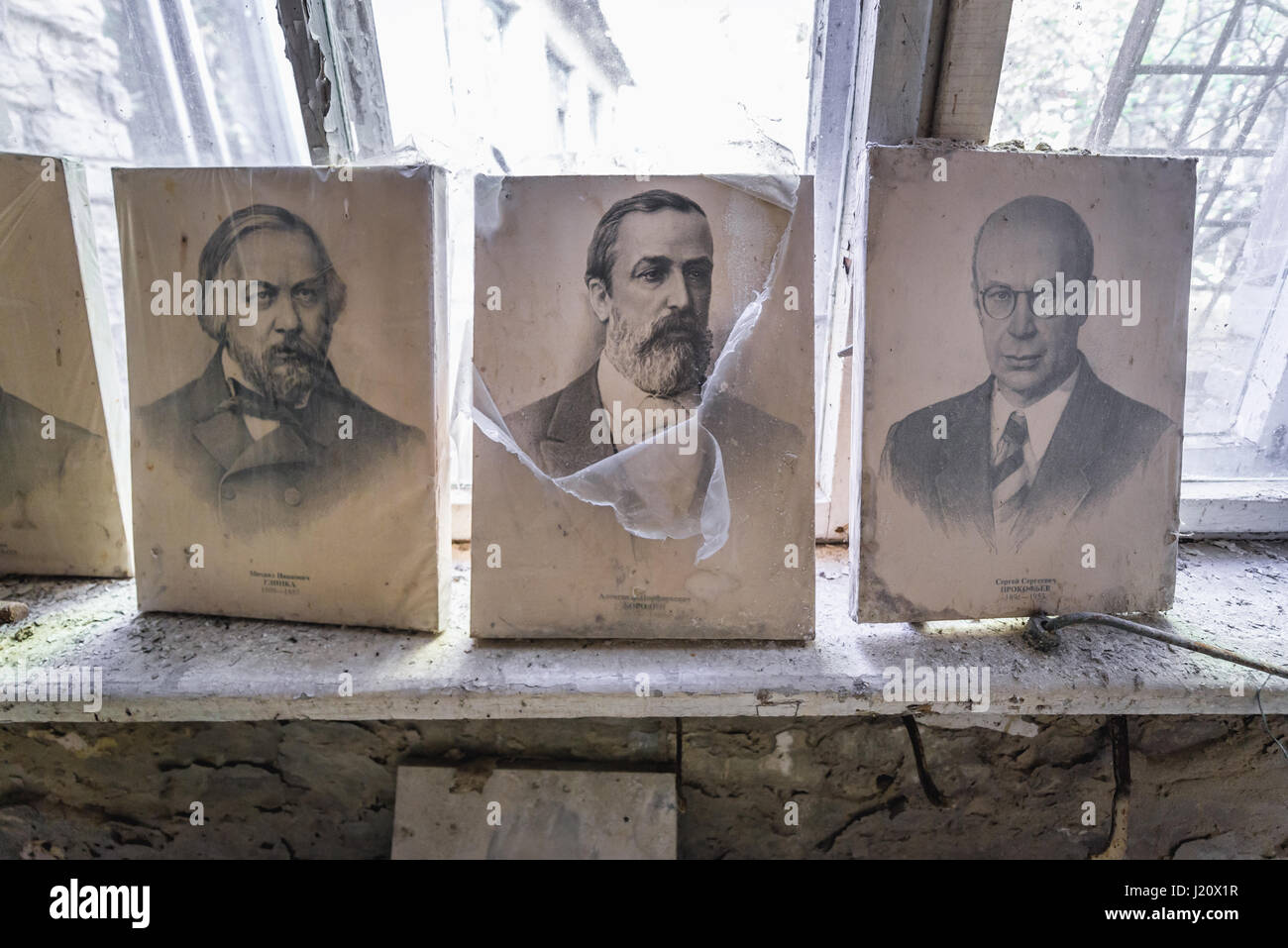 Portraits of Russian composers (Glinka, Borodin and Prokofiev) in abandoned high school of Chernobyl-2 military base, Zone of Alienation in Ukraine Stock Photo