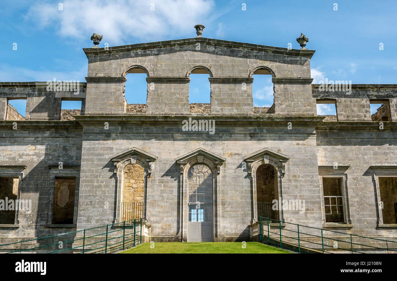 Ruined empty shell of Palladian mansion Penicuik House destroyed by