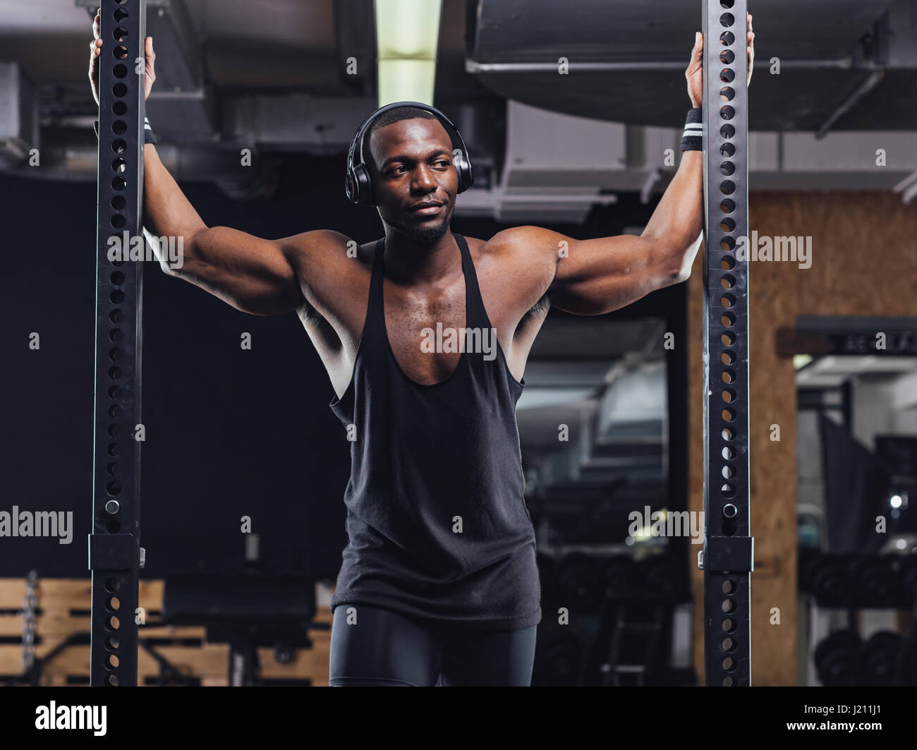 Athlete standing in gym, preparing for training Stock Photo