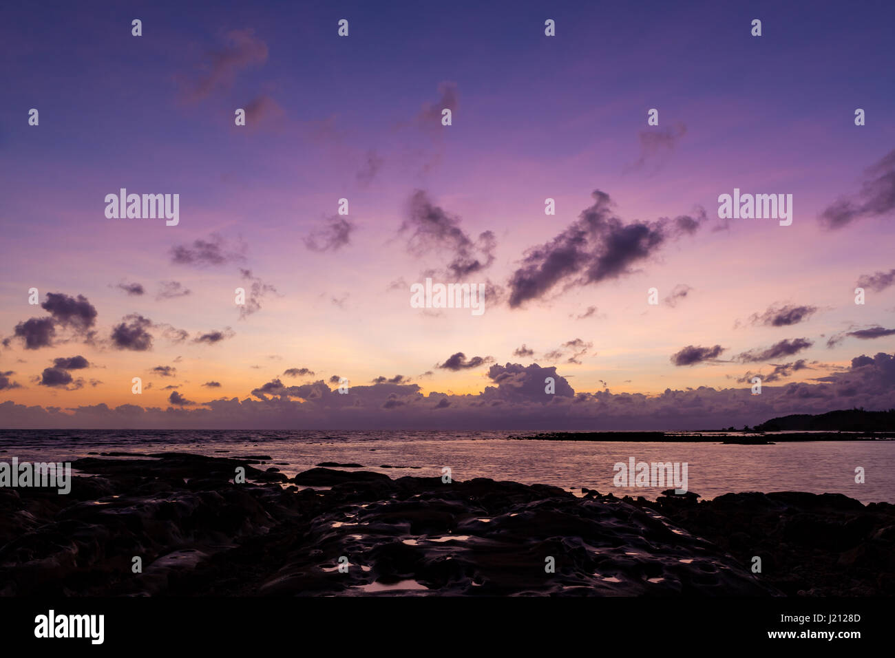 Beautiful rock patterns and sunrise at shore Stock Photo - Alamy