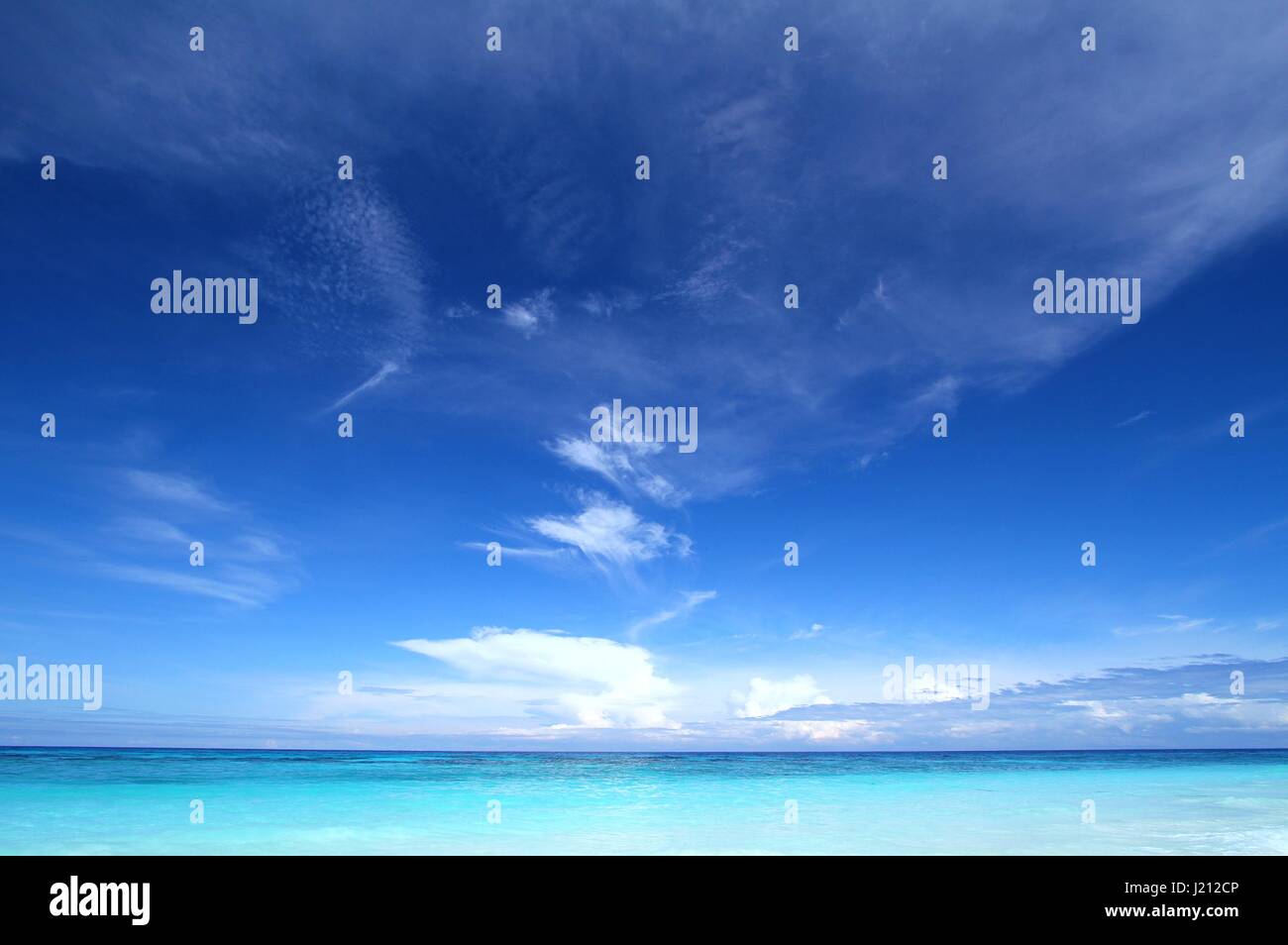 Beautiful tropical seascape with clear blue sky and soft white clouds. Tachai island, Andaman sea, Thailand Stock Photo