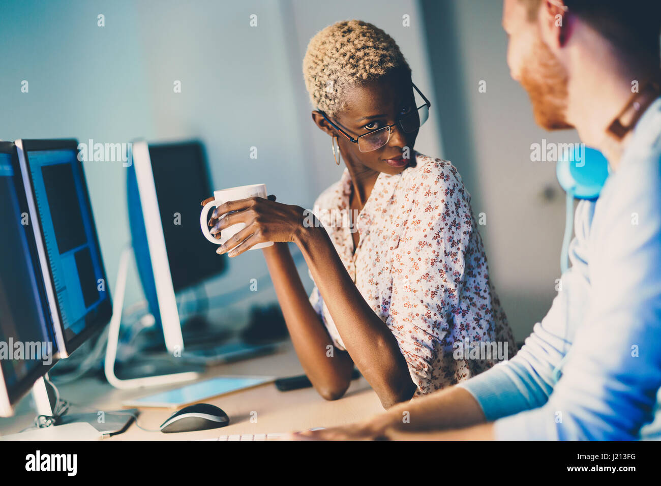 Woman responsible for helping customers az help desk concept Stock