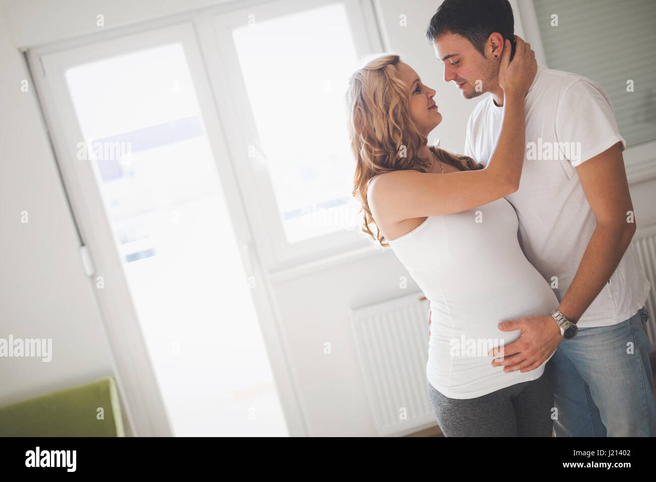 Beautiful couple in love awaiting baby with happiness Stock Photo - Alamy