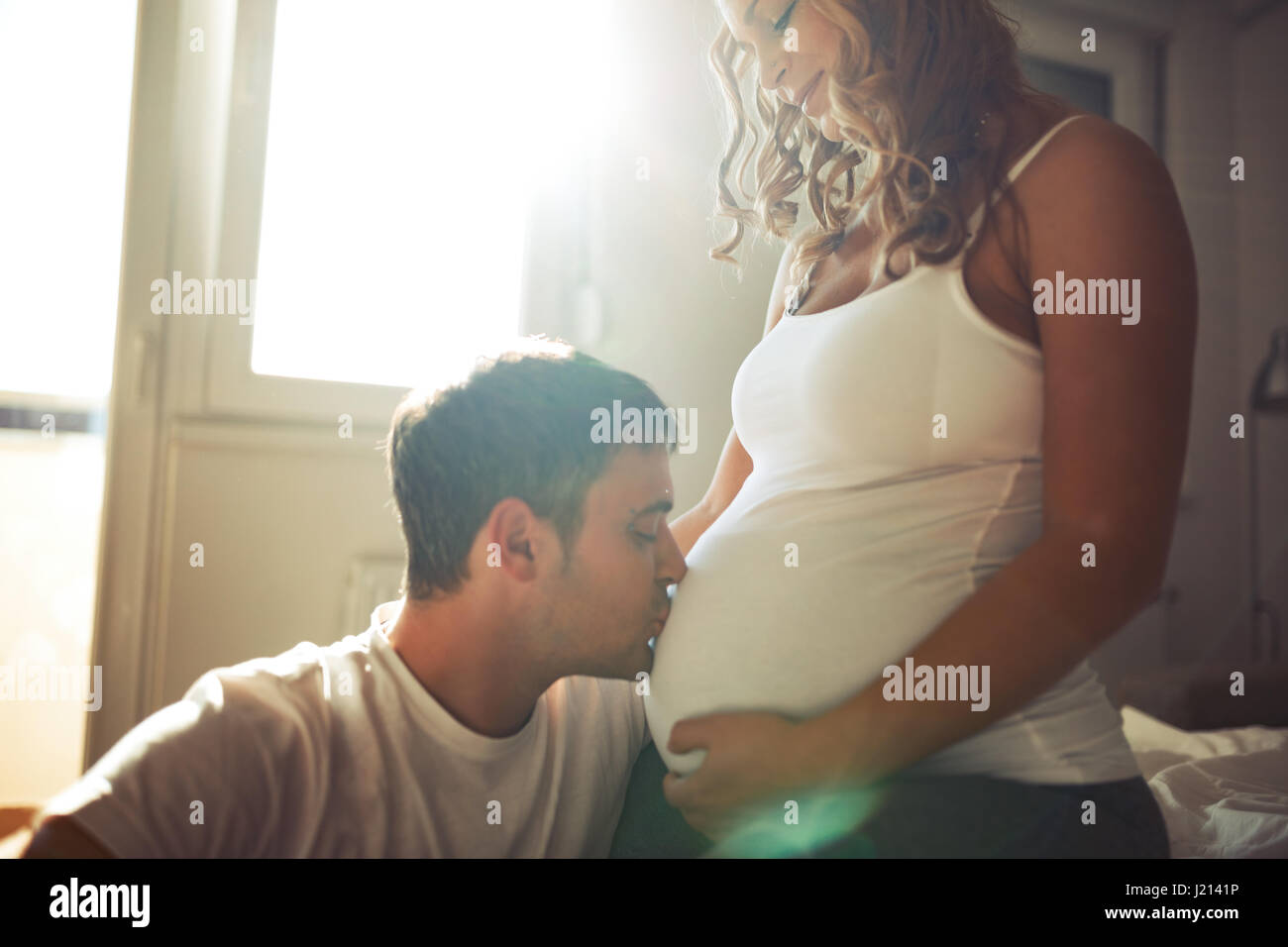 Beautiful couple in love awaiting baby with happiness Stock Photo - Alamy