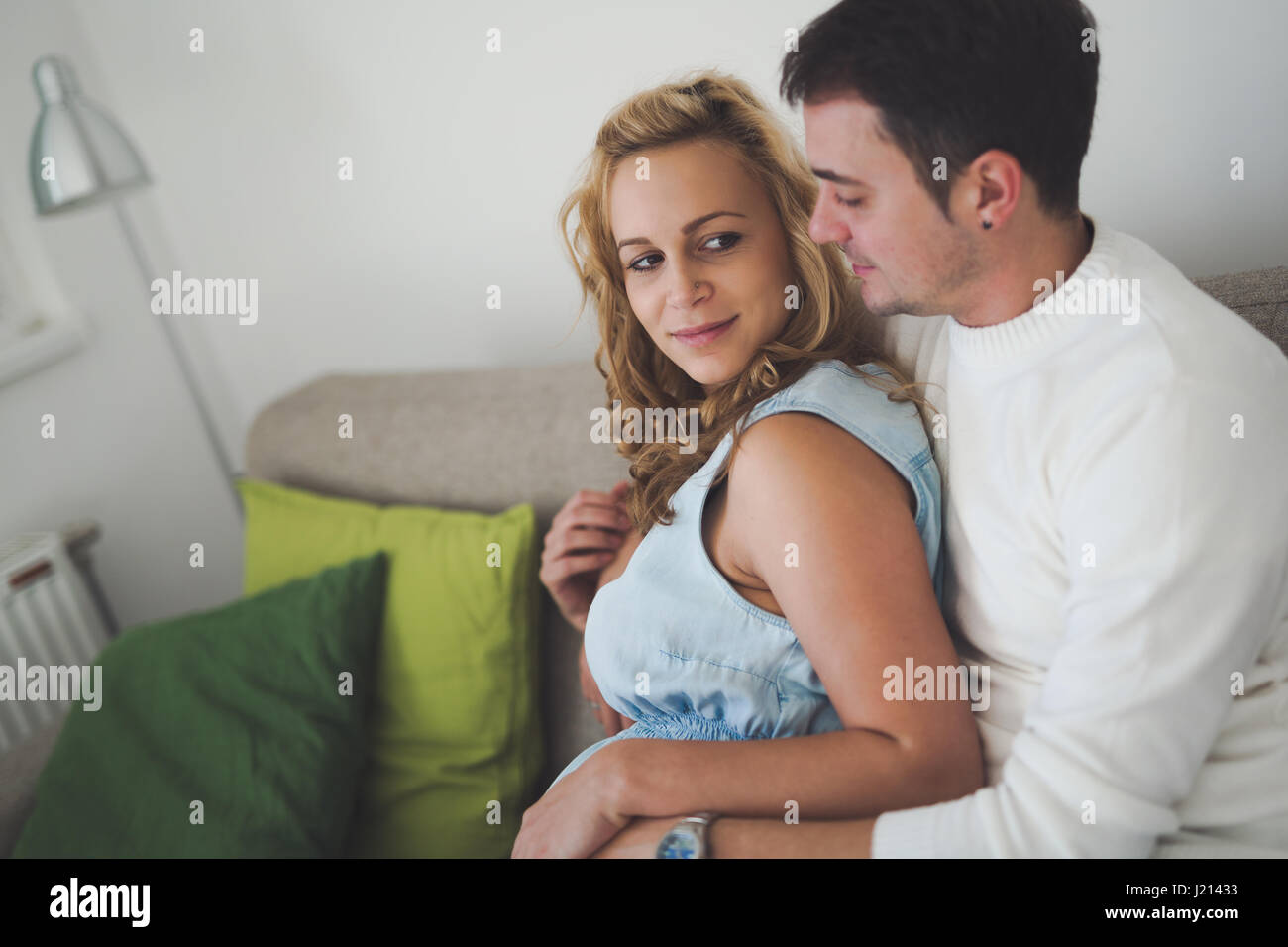 Beautiful couple in love awaiting baby with happiness Stock Photo - Alamy