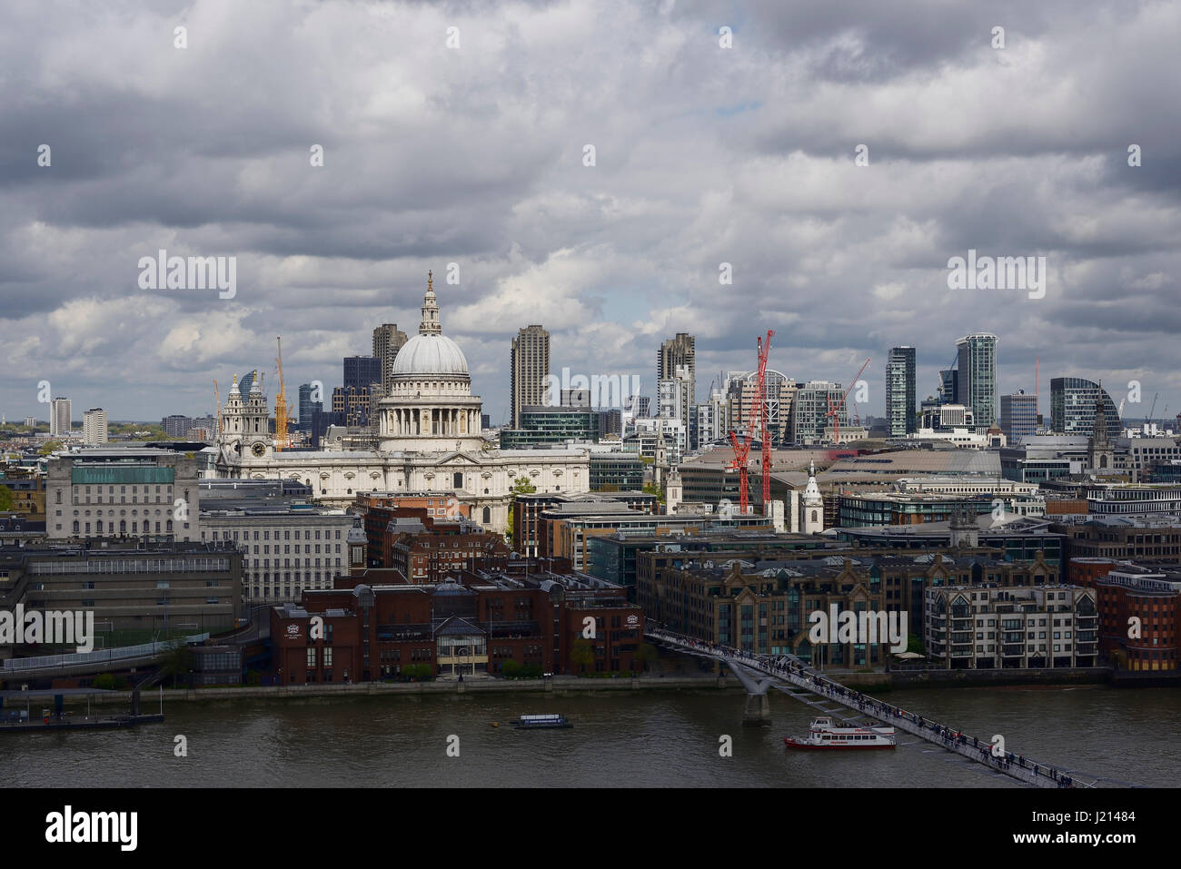 St Paul's Cathedral in sunlight amongst other city centre buildings in London UK Stock Photo