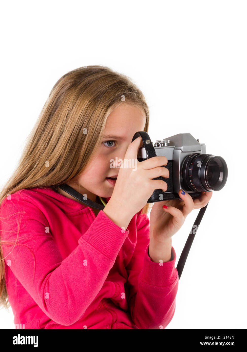 Little girl with an old camera isolated on a white background. Concepts : photography, retro, tourism, lifestyle.  Concepts : photography, retro, tour Stock Photo