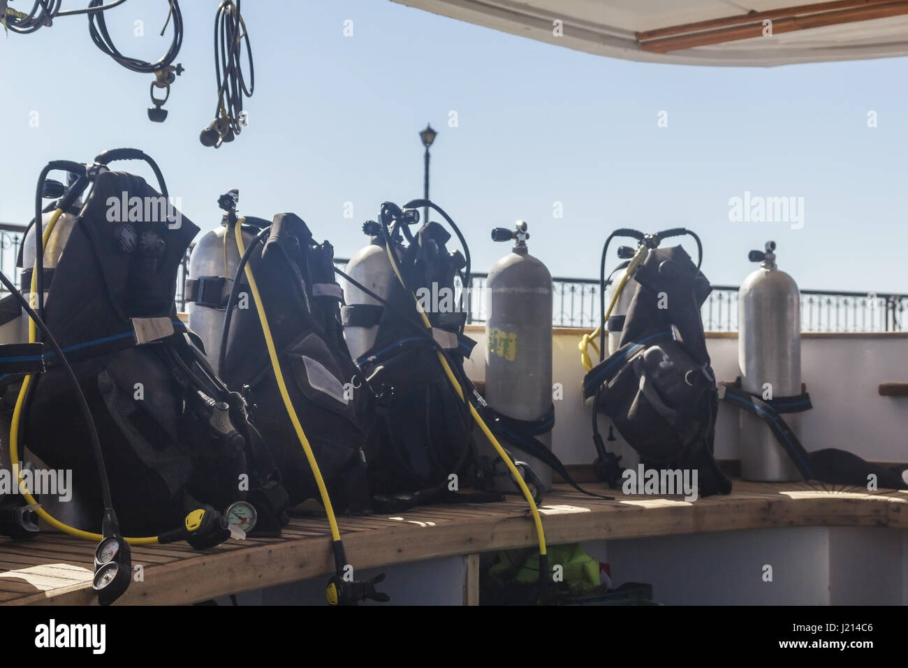 Equipment for scuba diving is on the bench on the yacht. Cylinders with